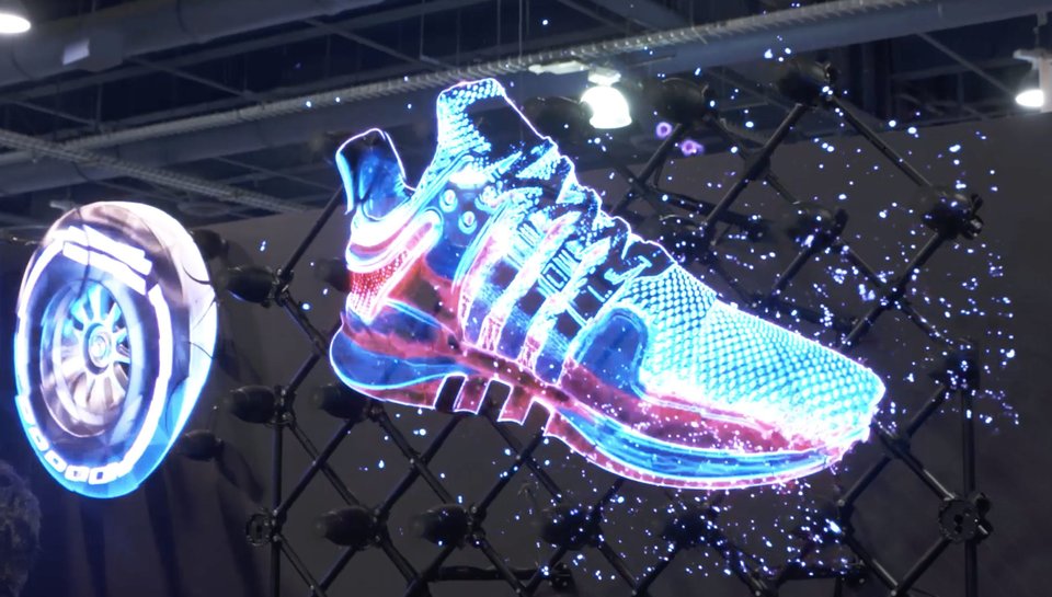 wall of holographic fans displaying a shoe